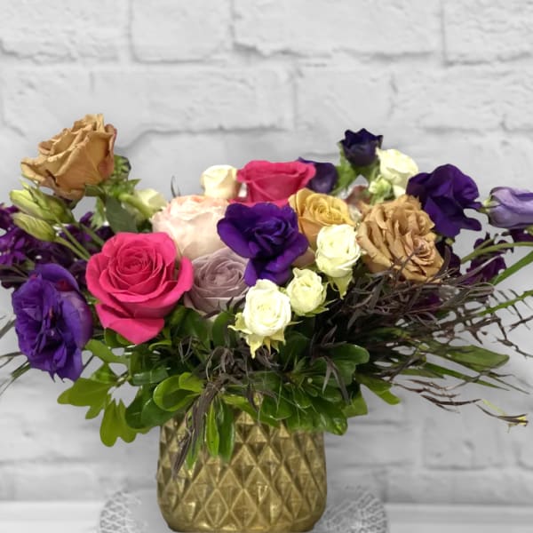 Mixed roses in a gold textured vase