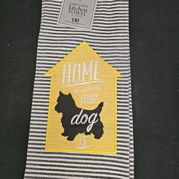 Striped kitchen towel with a yellow house patch and dog silhouette