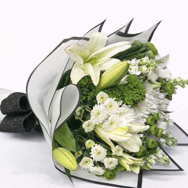 White lilies and green-white chrysanthemums wrapped in black-edged paper