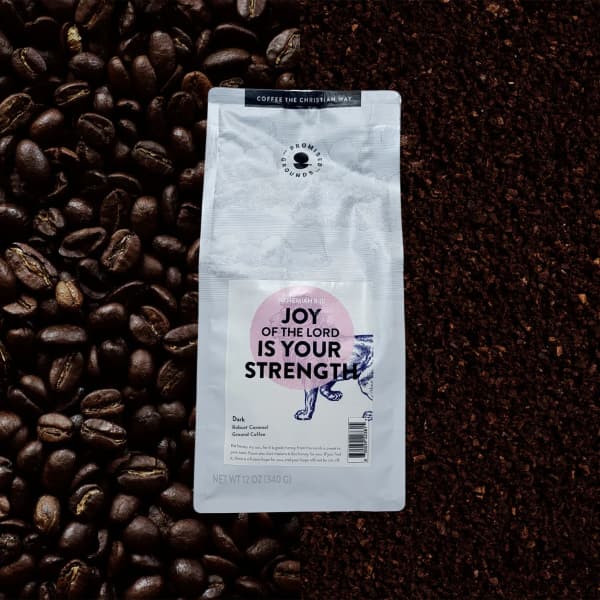 Bag of ground coffee on coffee beans