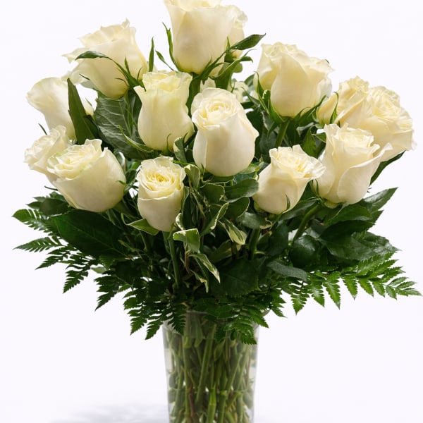 Bouquet of white roses in a clear glass vase