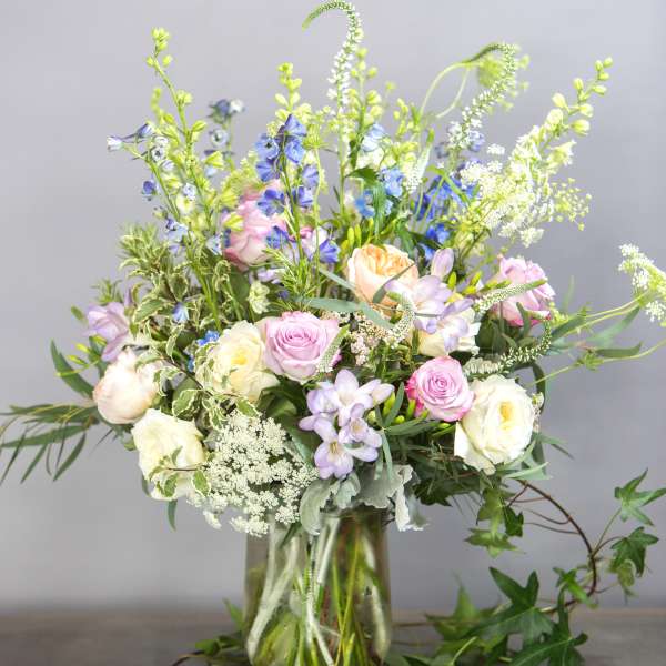 Mixed pastel bouquet in a clear glass vase