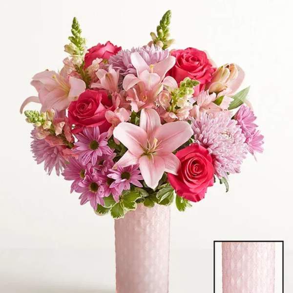 Pink and lavender bouquet in a tall pink vase
