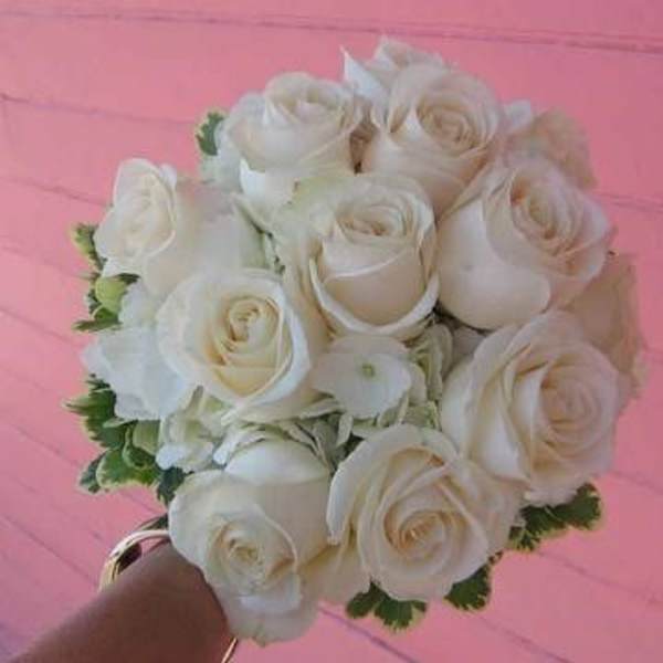 Bouquet of white roses with green accents