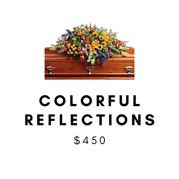 Colorful floral casket spray on a wooden coffin