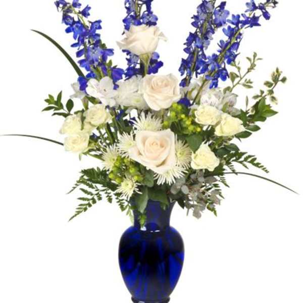 Blue and white floral arrangement in a cobalt vase