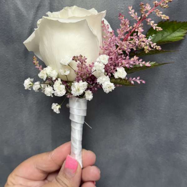 White rose pink boutonnière