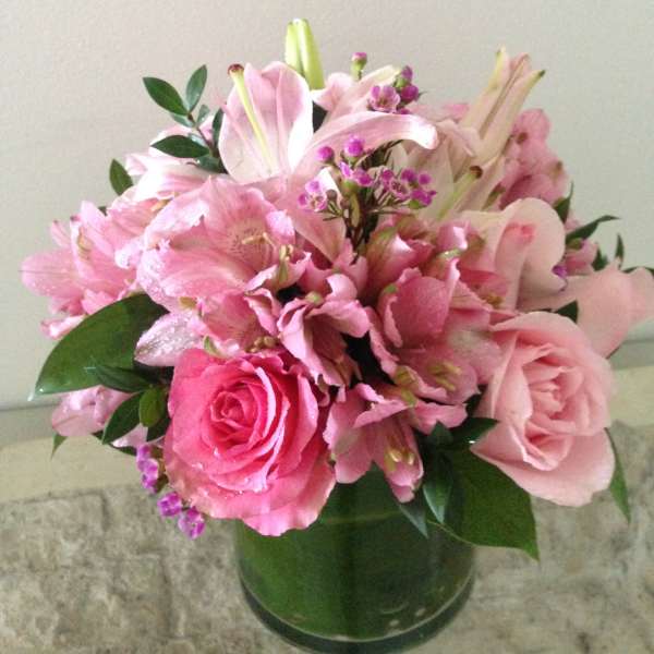 Pink mixed flower bouquet in a glass vase