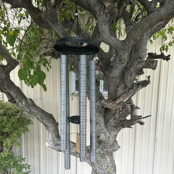 Wind chime hanging from a tree branch