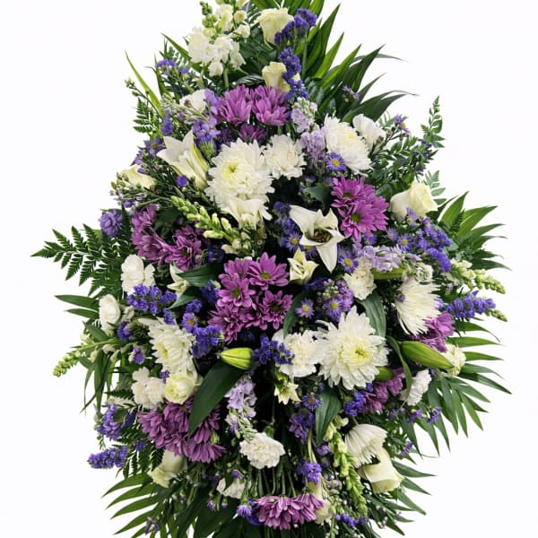 Large standing floral spray with white, purple, and lavender flowers