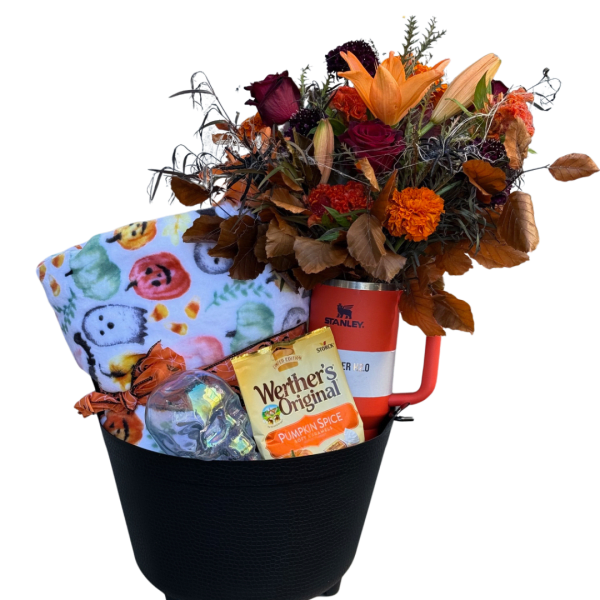 Fall gift basket with flowers, blanket, candy, and a red tumbler