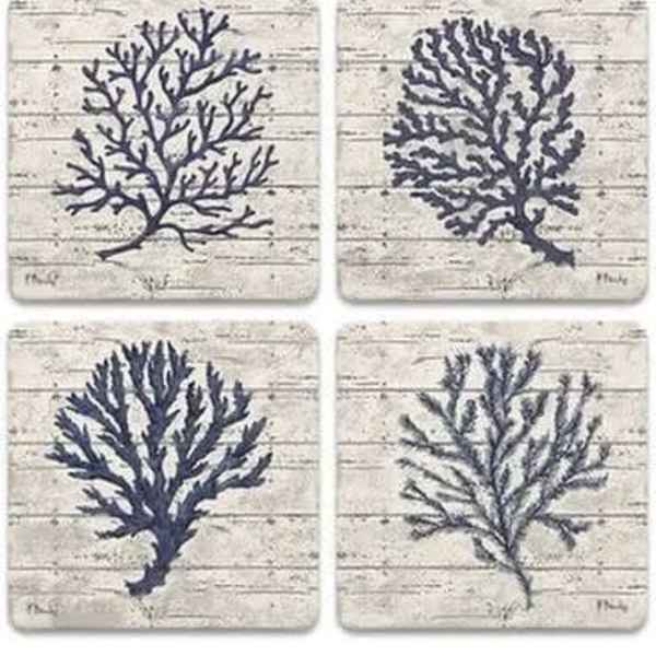 Set of four square coasters with navy coral designs on a whitewashed background