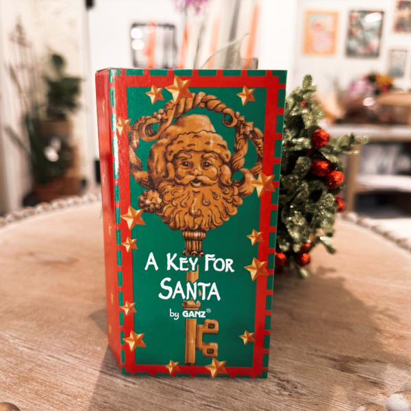 Holiday gift box labeled "A Key For Santa" with a decorative Santa face