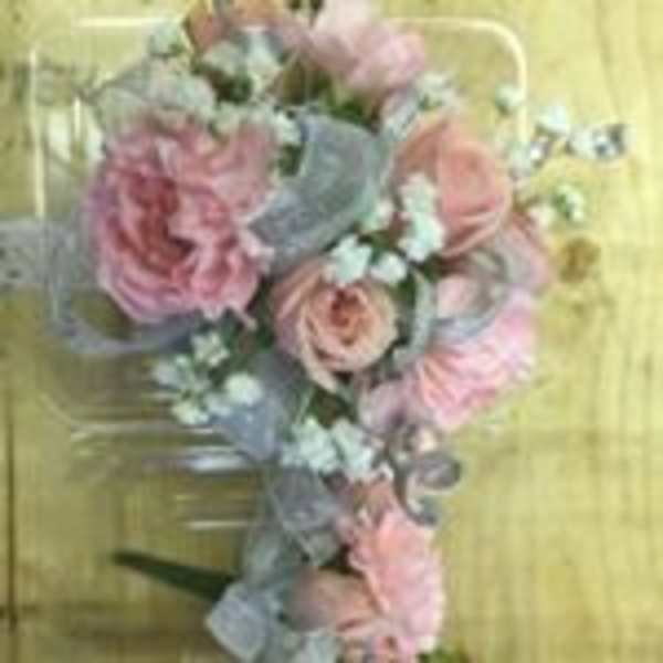 Pink and blue floral bouquet with ribbon on a yellow background