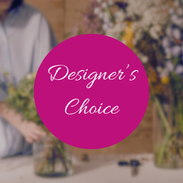 Designer’s Choice text over a blurred florist workspace