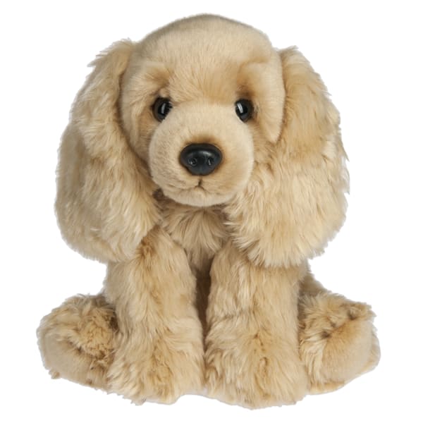 Plush tan puppy with floppy ears sitting on a white background