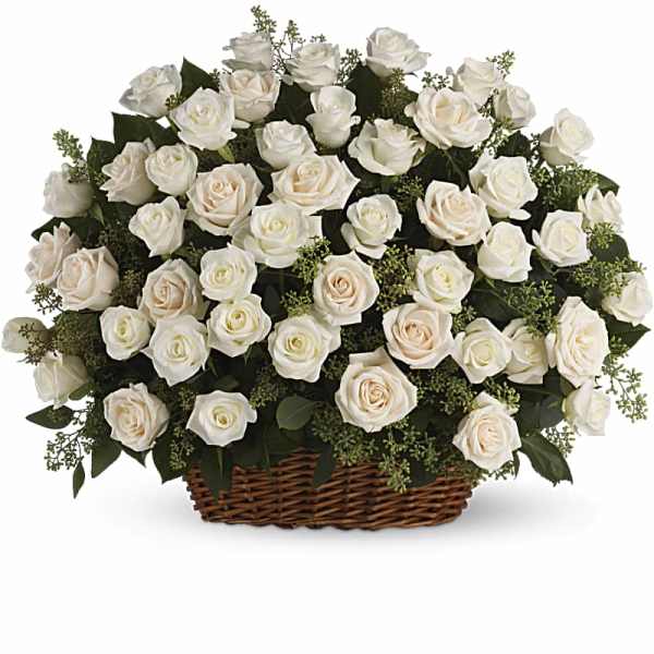 White roses arranged in a wicker basket