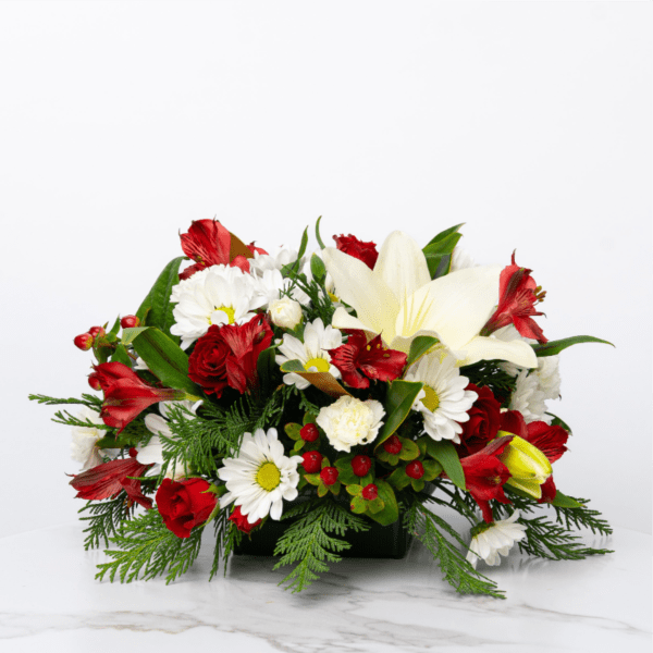 Red and white floral arrangement in a black container