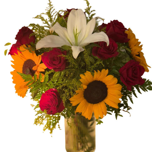 Bouquet of red roses, sunflowers, and a white lily in a gold vase