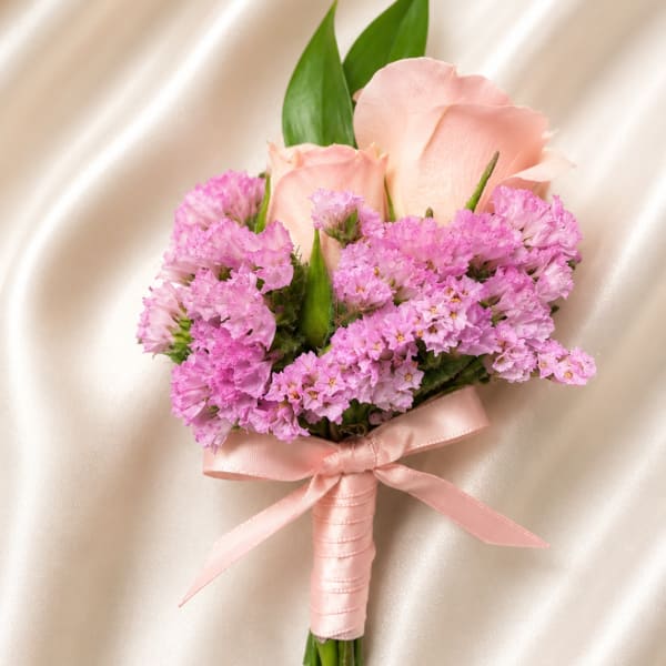 Pink rose and purple boutonniere with satin ribbon
