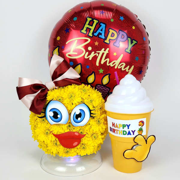 Yellow flower face arrangement with a birthday balloon and drink cup