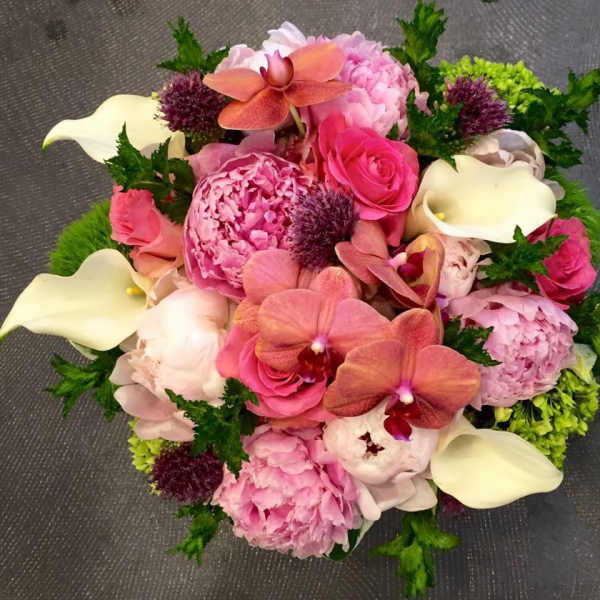 Pink bouquet with orchids, roses, peonies, and white calla lilies