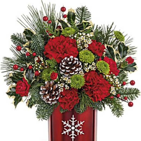 Christmas bouquet in a red vase with pinecones and red flowers