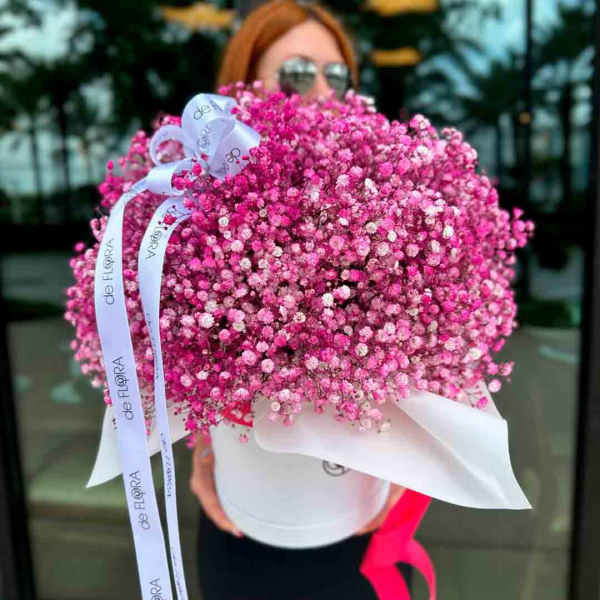 Large pink baby's breath bouquet in a white hatbox with ribbon