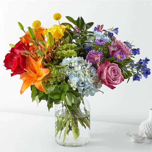 Colorful mixed bouquet in a clear glass vase