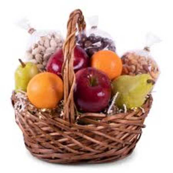 Wicker basket filled with assorted fruit and nuts