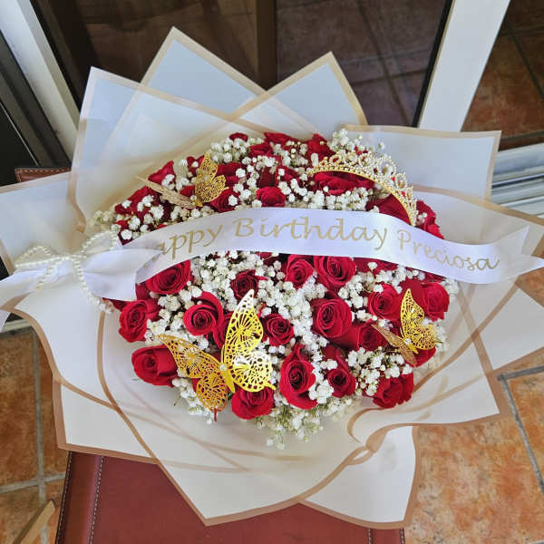 Bouquet of red roses with white baby's breath and gold butterfly accents
