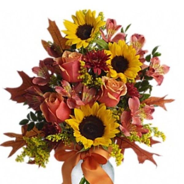 Bouquet with sunflowers, roses, and pink alstroemeria in warm autumn colors