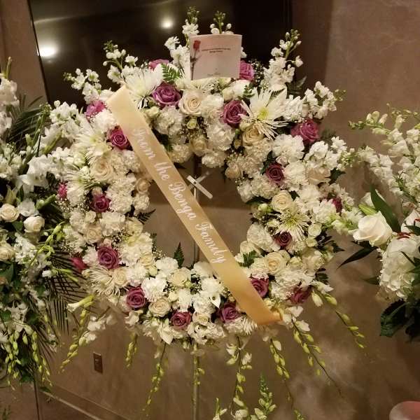 Whitew pink wreath. From Roma Florist