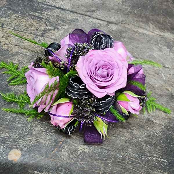 Lavender rose bouquet with purple ribbon and black accents