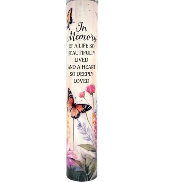 Memorial candle with butterflies and floral artwork