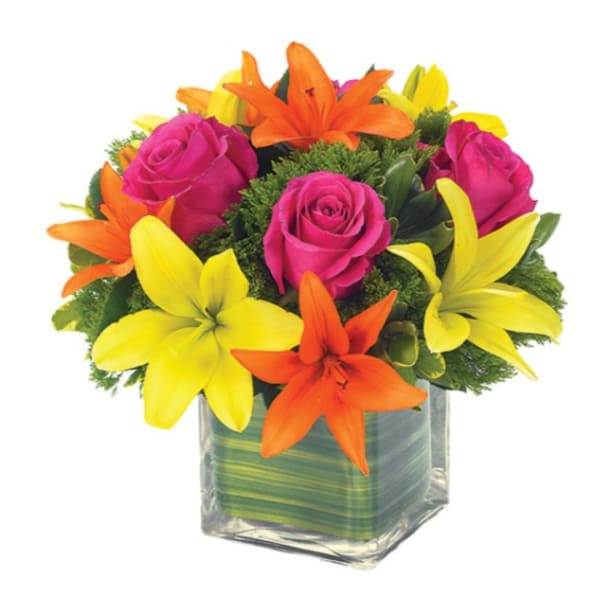 Bouquet of pink roses and orange and yellow lilies in a glass vase