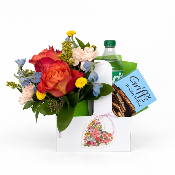 Mixed flower gift box with a soda bottle and pecan toffee box