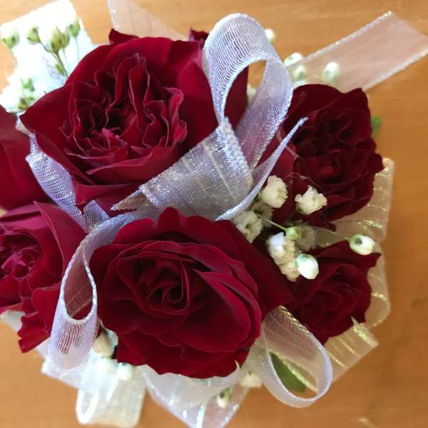 Bouquet of red roses with white baby's breath and silver ribbon