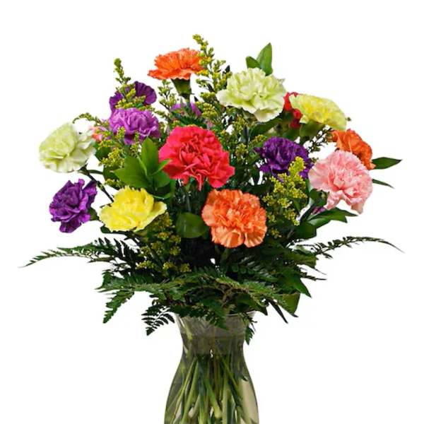Mixed bright carnations in orange, yellow, purple, green, and pink arranged in a clear glass vase