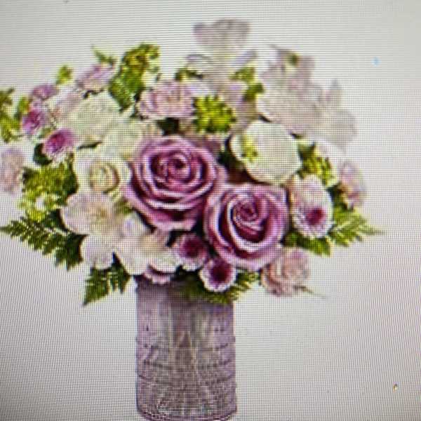 Bouquet of pink and white roses in a glass vase