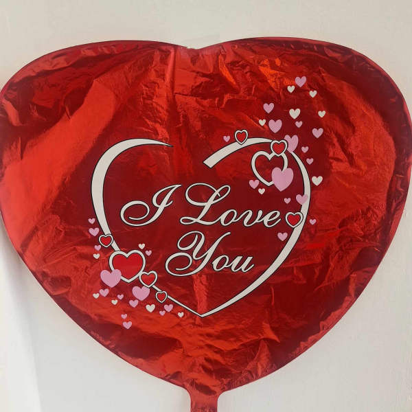 Red heart-shaped foil balloon with "I Love You" text