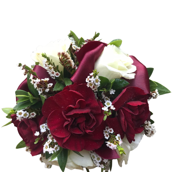 Bouquet of red and white roses with small white filler flowers