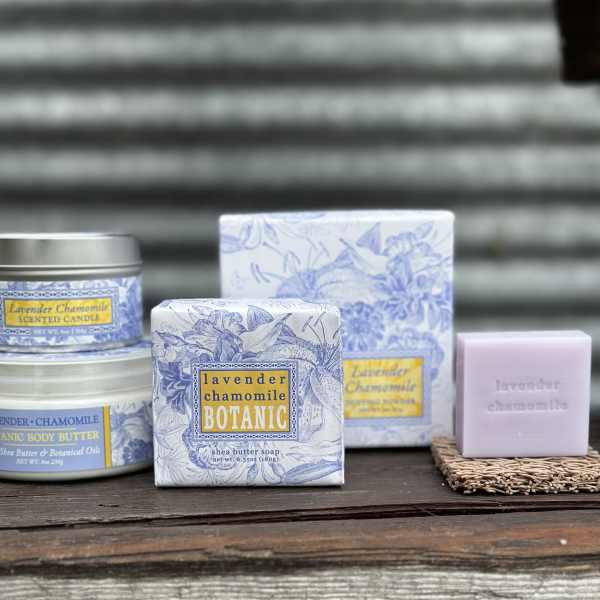 Lavender chamomile scented soap, candle, and body butter products on a shelf