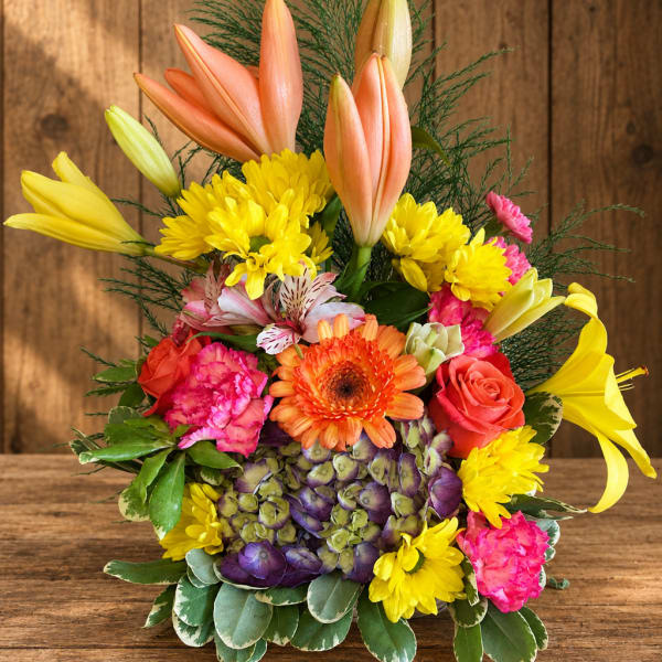 Colorful mixed bouquet with lilies, roses, chrysanthemums, and hydrangeas