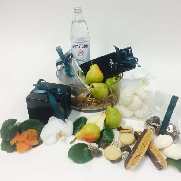 Gift basket with pears, cookies, chocolates, and white orchids