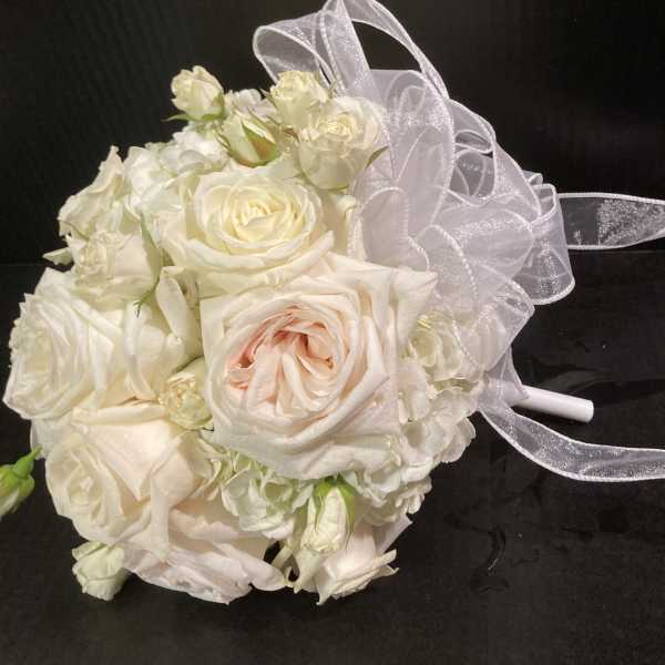 White rose bouquet with a sheer ribbon bow