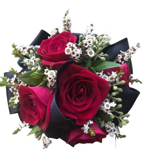 Bouquet of red roses with small white filler flowers and black ribbon