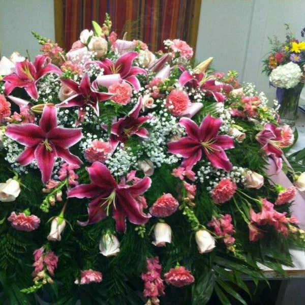 Large casket spray with pink lilies and carnations