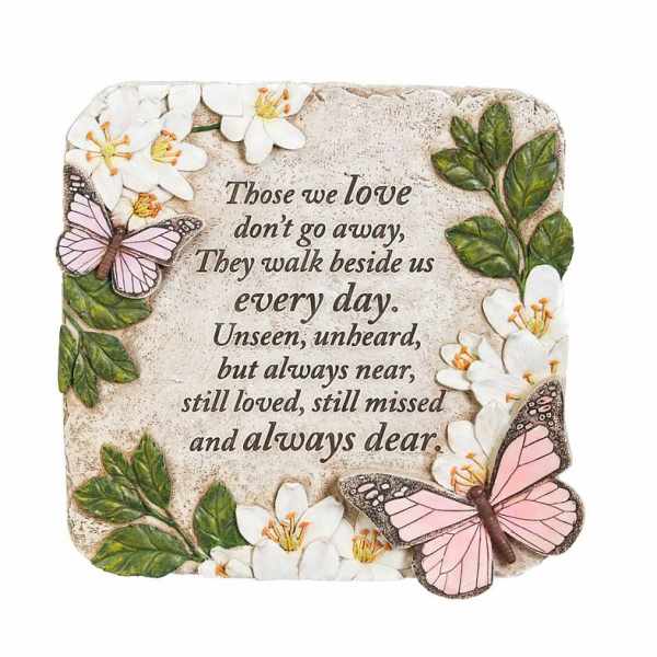 Decorative memorial plaque with flowers, butterflies, and a sympathy quote
