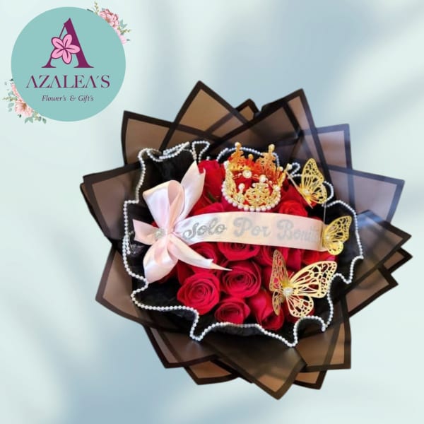 Bouquet of red roses with a crown and ribbon